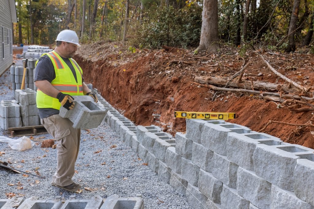 retaining wall with fence ideas