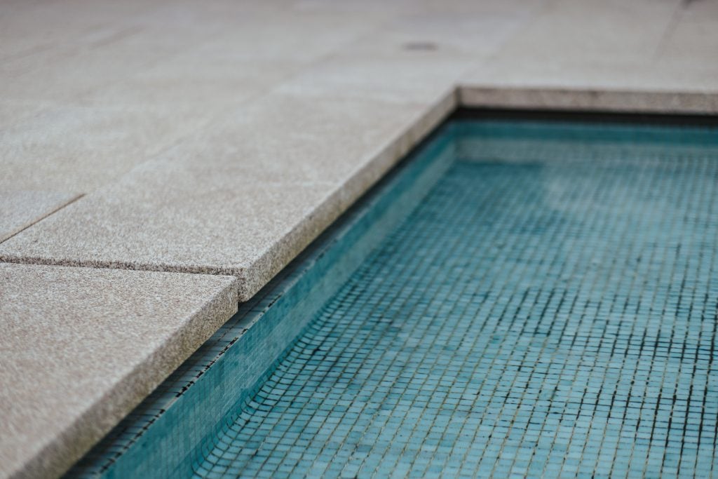 honed concrete around pool